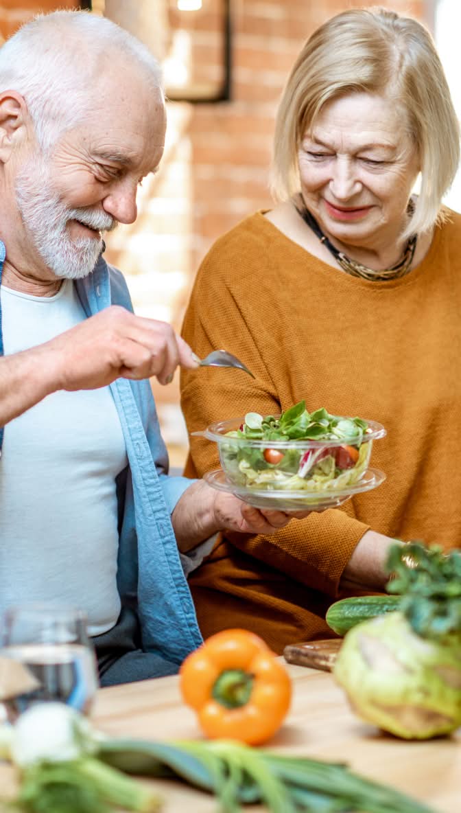 Couple making a salad