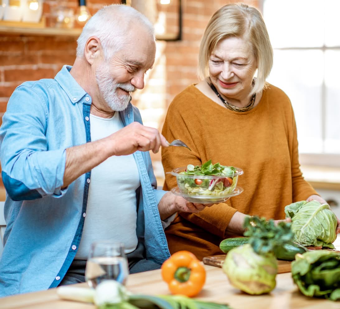 Couple making a salad